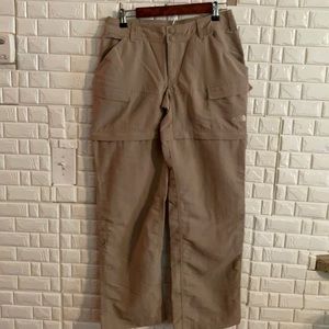 The North Face women's.  Convertible Pants Beige Cargo Shorts Hiking Outdoor